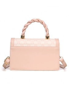 Detail of pink crossbody bag with woven handle and M letter print fabric flap