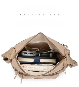 Internal view of khaki nylon crossbody bag showing multiple organized storage compartments