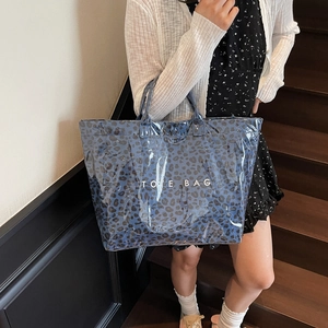 Blue leopard print tote bag with glossy finish and top handles for casual commuting