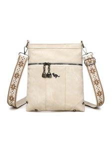 Detail of crossbody bag with kangaroo logo, front zipper, and patterned woven strap