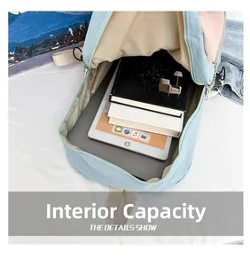Internal capacity of waterproof yoga backpack showing a laptop and books inside