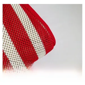 Close-up of red and white striped woven mesh fabric showing high-quality knitted texture
