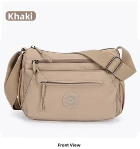 Front view of khaki nylon crossbody bag with multi-pocket design and adjustable strap
