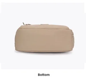 Detailed view of the flat bottom stitching and nylon fabric texture of the crossbody bag