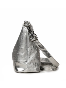Detail of silver boston bag with ostrich texture finish and polished metal buckles