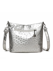 Close-up of silver ostrich texture leather handbag with metal chain and zipper detail