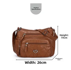 Sac bandoulière en cuir marron avec dimensions de 26 cm de large et 19 cm de haut montrées
