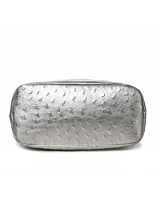 Detail view of silver ostrich texture leather bottom on a metallic boston bag