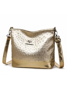 Close-up of golden ostrich texture Boston bag featuring a metallic kangaroo brand logo
