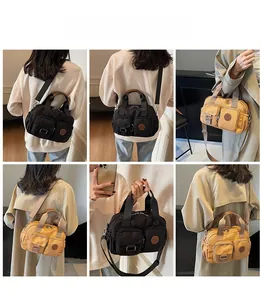 Waterproof nylon crossbody bag in black and yellow shown on model from various angles