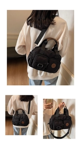 Detail of black waterproof nylon crossbody bag with multi-pocket and circular logo