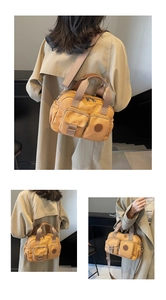 Detail of mustard yellow water-resistant nylon crossbody bag with multi-pocket design