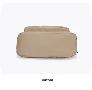 Detailed bottom view of beige nylon crossbody bag showing neat stitching and texture