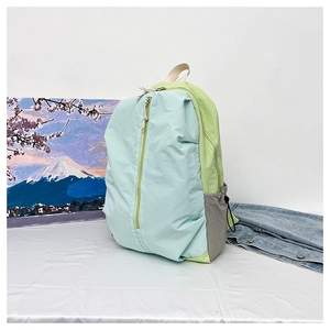 Detail of color-block waterproof yoga backpack with side drawstring pocket and zippers