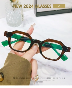 Detail of tortoiseshell frame with contrast green arms and CE certification marking