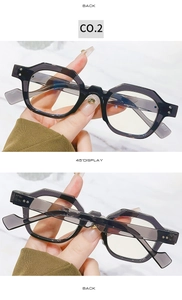Detail of dark gray geometric polygonal sunglasses with thick acetate frames and 45-degree view