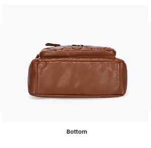 Détails du fond d'un sac en cuir marron montrant les coutures et le grain de cuir