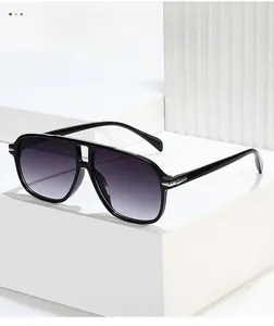 Detail of pilot aviator sunglasses with gradient lenses and silver temple accents