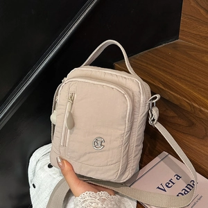 Chic beige nylon crossbody bag with large capacity and multi-pocket design for business
