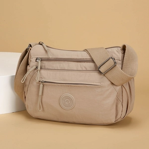 Khaki multi-pocket nylon crossbody bag with adjustable wide strap for daily travel