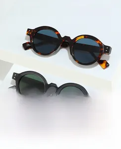 Detailed macro view of vintage round sunglasses frames with silver rivets and model SZ2003