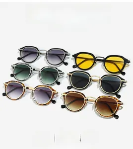 Flat lay of retro oval sunglasses in six colors including gradient grey and tortoise frames
