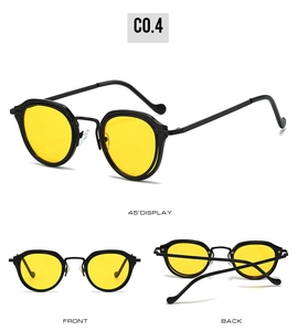 Three-view display of vintage oval sunglasses with black frames and yellow lenses