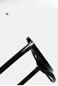 Detailed close-up of high-quality metal hinge on lightweight black eyeglass frames