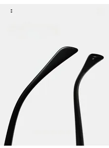 Detail view of glossy black curved temple arms on double-bridge sunglasses