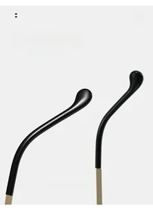 Close-up of ergonomic curved black resin temple tips for comfortable sunglasses fit