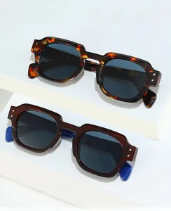 Detail view of retro square tortoise shell sunglasses with blue contrast temple tips