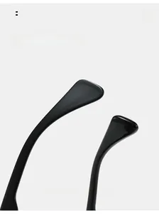 Detail view of ergonomic curved mirror legs on stylish black square frame sunglasses