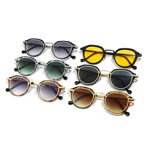 Collection of vintage oval sunglasses in six colors with stylish metal and acetate frames