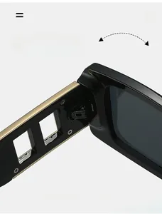Macro view of durable metal hinge with gold trim on square frame black sunglasses