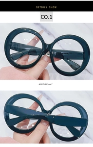Front and 45-degree angle display of oversized round black vintage fashion glasses