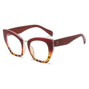 Cat eye blue light blocking glasses in burgundy and leopard print with silver rivet detail