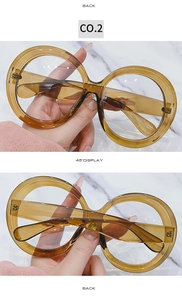 Detail view of oversized round tortoiseshell glasses showing back and 45-degree angle
