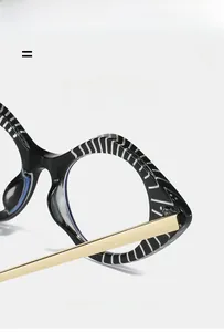Detail of zebra pattern frame and gold metal hinge on minimalist cat-eye glasses