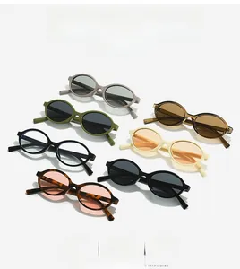Detail of multiple oval frame sunglasses in assorted colors on a white background