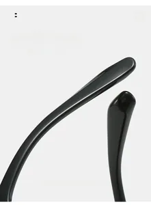 Detail of curved ergonomic temple tips on black glossy resin fashion sunglasses