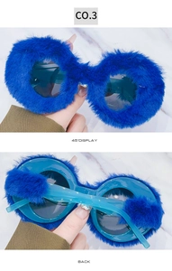 Detail view showing blue plush frame and semi-transparent temples of these round sunglasses