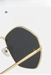 Detail view of lightweight gold metal frame sunglasses with super elastic nose pads