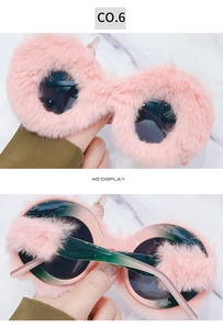 Detailed views of round plush sunglasses in pink furry frame with dark lenses