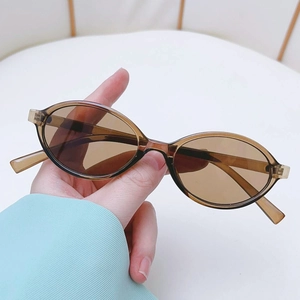 Fashionable retro oval sunglasses with translucent brown frames and matching lenses