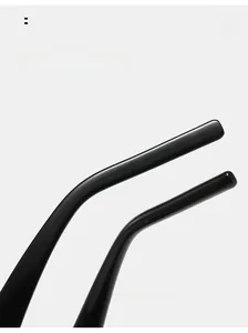 Detail of glossy black curved mirror legs on oval sunglasses for a comfortable fit