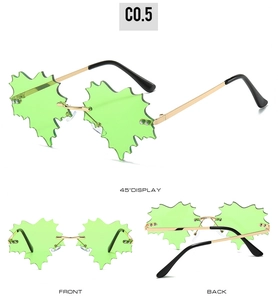 Detailed views of rimless green maple leaf shaped sunglasses with gold metal frames
