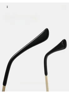 Close-up of curved metal temples with ergonomic black tips for rimless leaf sunglasses