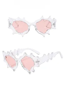Detailed front and side view of Y2K irregular sunglasses with light pink lenses