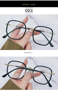 Detail view of square green acetate eyeglass frames with gold metal temples and CE marking
