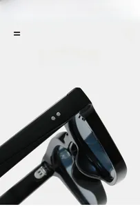 Détail de lunettes de soleil carrées noires montrant les charnières et les rivets